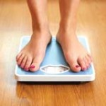 woman-weighing-herself-sm