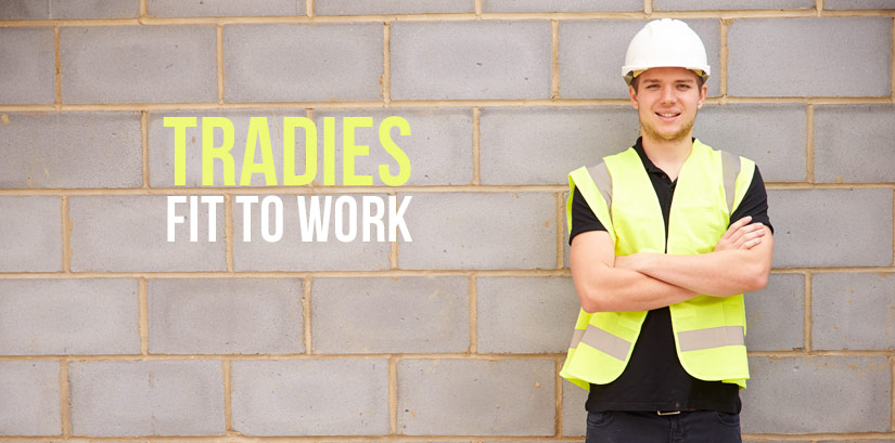 Tradies standing with his arms crossed.